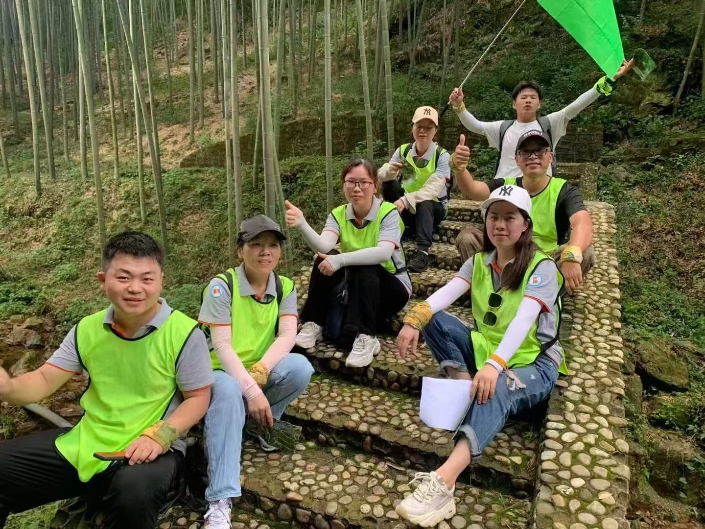 DryIceSys team resting together during a bamboo forest team-building activity